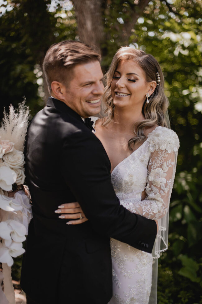 bride and groom laughing