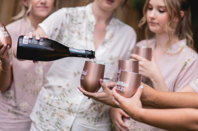 bride pouring champagne