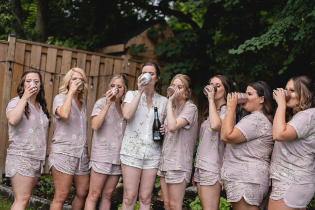 bridesmaids drinking champagne