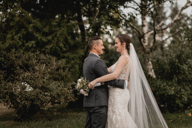 bride with long train and veil on wedding day