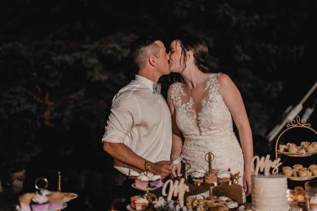 bride and groom cutting cake