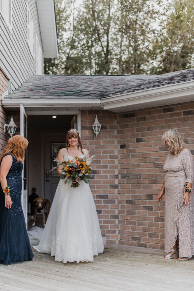 bride and bridesmaids first look