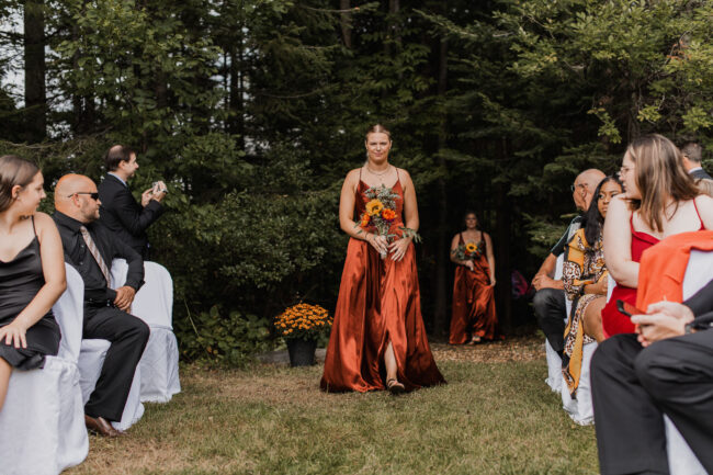 bridesmaids walking down aisle