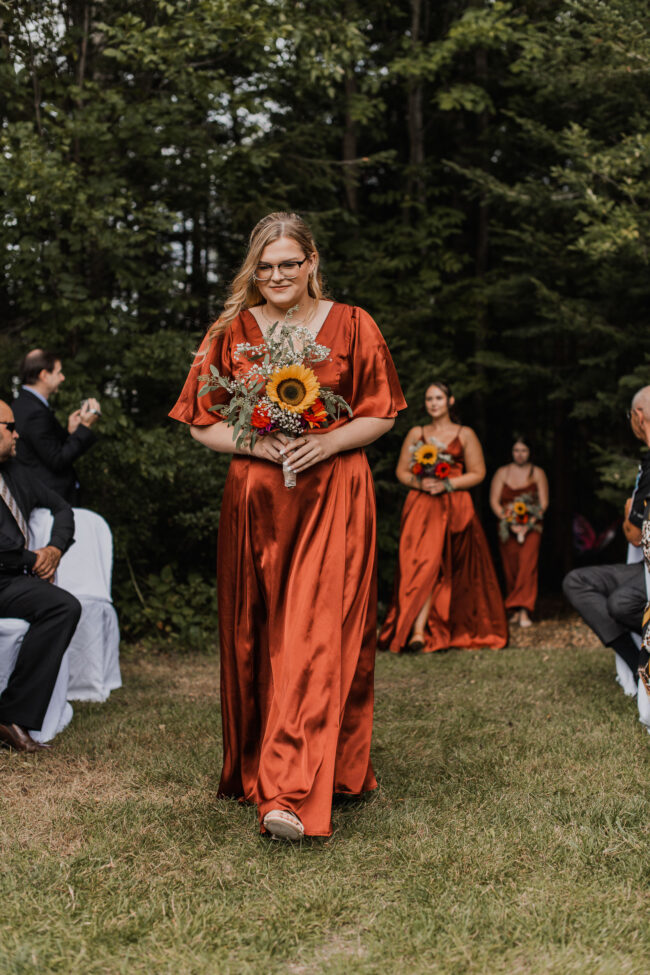 bridesmaids walking down aisle
