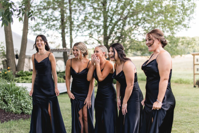 bride's first look with bridesmaids