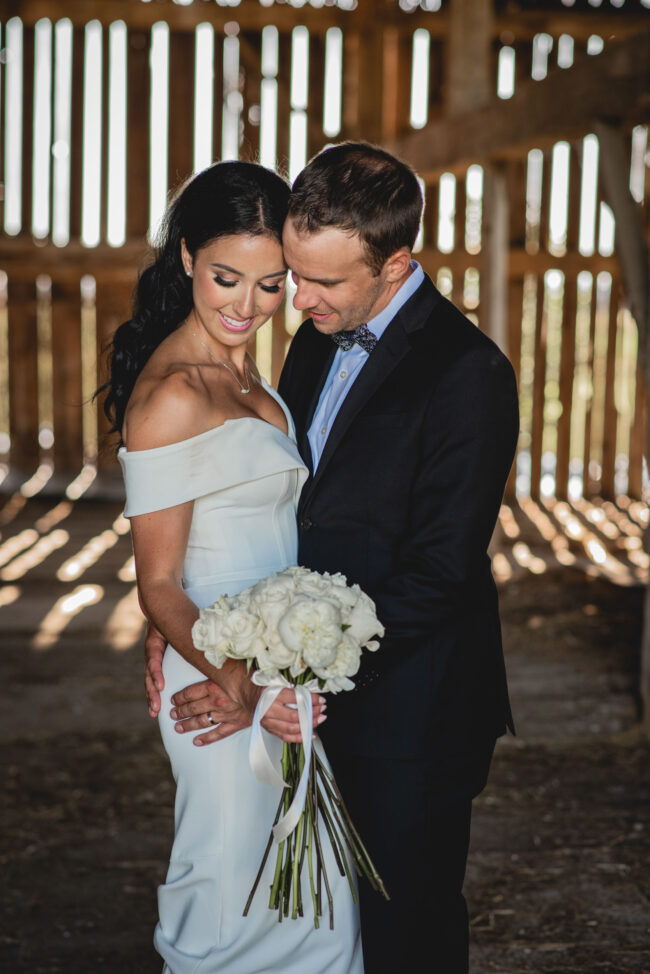 bride and groom portraits in barn
