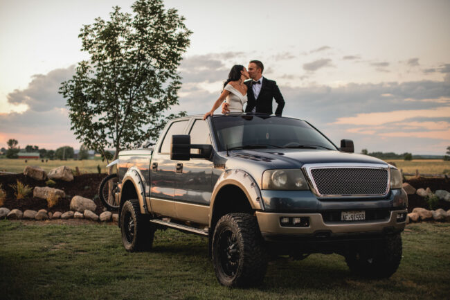 bride and groom in truck farm wedding