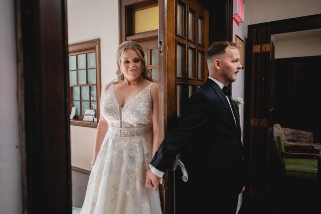 bride and groom holding hands prior to ceremony