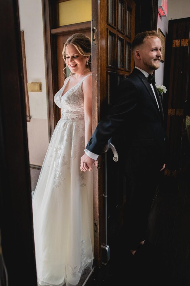 bride and groom holding hands prior to ceremony