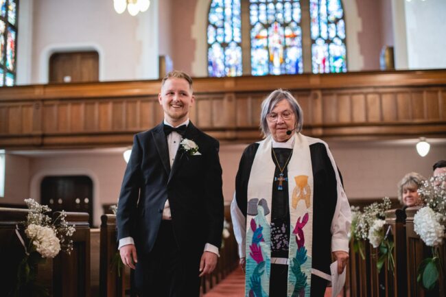 groom walking down aisle