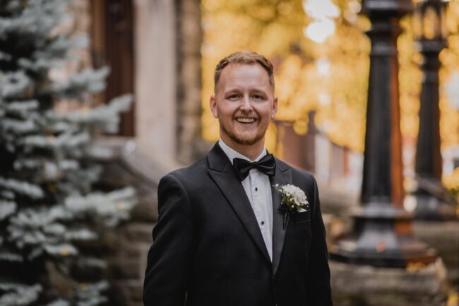 groom smiling on wedding day