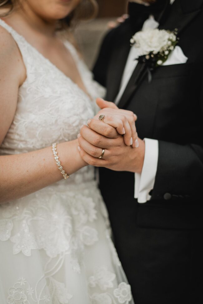 bride and groom holding hands