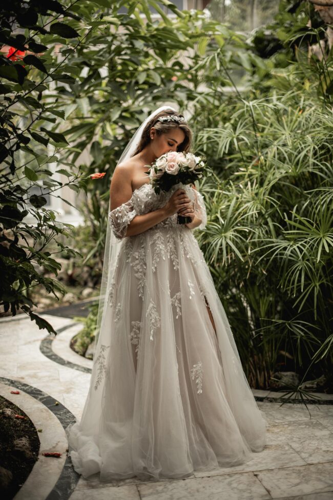 bride smelling wedding bouquet