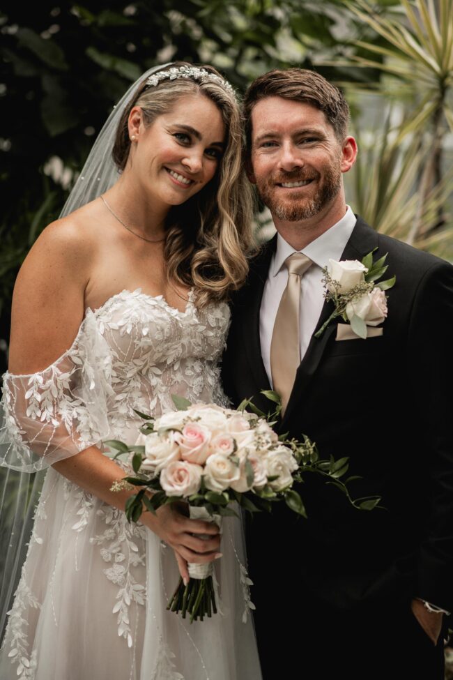 bride and groom in canadian forces college conservatory garden