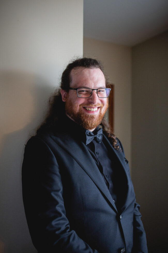 groom smiling on wedding day