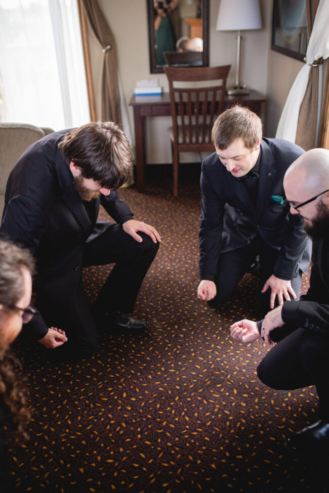 groom and groomsmen getting ready