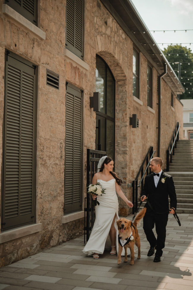 bride and groom with dog